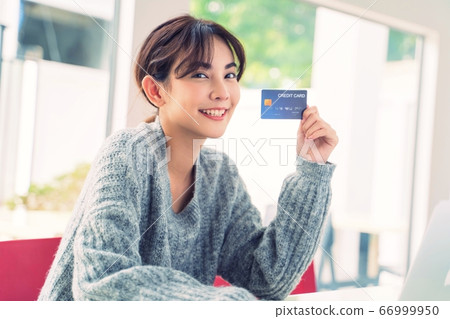 Young pretty woman online shopping Credit card enjoying person material Young pretty woman online shopping Credit card enjoying person material 66999950