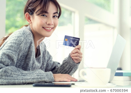 Young beautiful woman online shopping enjoying person material 67000394