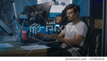 Video game developer at work Video game developer at work 67001619