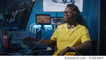 Video game developer at work 67001667