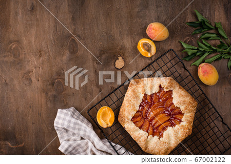 Sweet homemade galette pie with apricots Sweet homemade galette pie with apricots 67002122