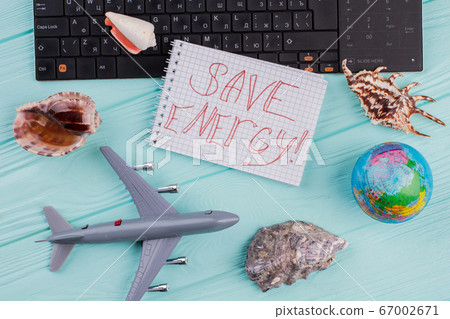 Save energy words on notepad in traveling composition. Save energy words on notepad in traveling composition. 67002671