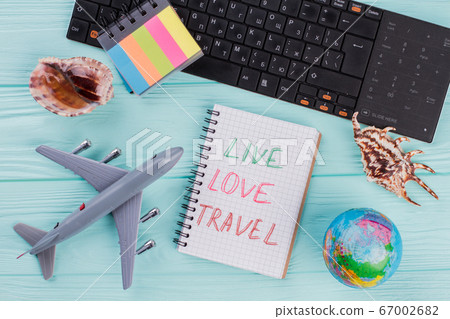 Preparation for travel, trip vacation, tourism mock up of airplane, sea shells ,stickers,globe on azure wooden table. Preparation for travel, trip vacation, tourism mock up of airplane, sea shells ,stickers,globe on azure wooden table. 67002682