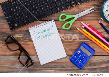 Financial education concept and school accessories. Financial education concept and school accessories. 67002999
