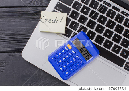 Close up calculator on the laptop keyboard. 67003284