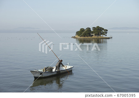 Shijimi fishing on Lake Shinji and Himegashima seen from Matsue city 67005395