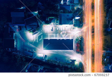 Aerial view of light of car on road and car park Aerial view of light of car on road and car park 67008237