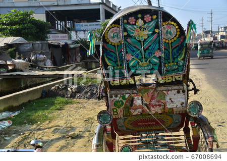 Cox's Bazar in Bangladesh Cityscape of Koratori Road Cycle rickshaw and flashy car body 67008694