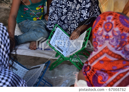 Cox's Bazar in Bangladesh Muslim children studying at Aozora School Arabic textbooks Cox's Bazar in Bangladesh Muslim children studying at Aozora School Arabic textbooks 67008782