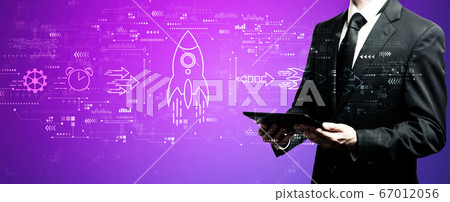 Rapid growth concept with businessman using his tablet 67012056