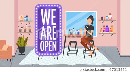 female stylist holding brushes we are open board coronavirus quarantine is over fashion makeup concept female stylist holding brushes we are open board coronavirus quarantine is over fashion makeup concept 67013551