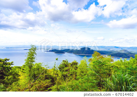 Beautiful scenery views of nature with a large reservoir above the Srinagarind Dam at Rai Ya Yam in Si Sawat District, Kanchanaburi Thailand. 67014402