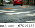 A little dangerous pedestrian crossing on a sharp curve 67019122