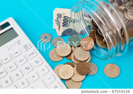 Money and calculator blue background 67019138