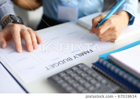 Calculator on working table Calculator on working table 67019634