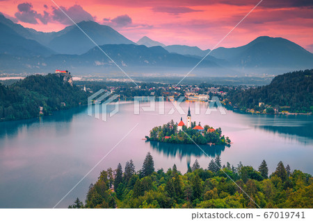 Amazing Pilgrimage church and lake Bled at sunset, Slovenia, Europe Amazing Pilgrimage church and lake Bled at sunset, Slovenia, Europe 67019741