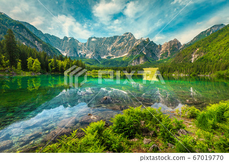 Alpine landscape with lake Fusine and Mount Mangart, Italy Alpine landscape with lake Fusine and Mount Mangart, Italy 67019770