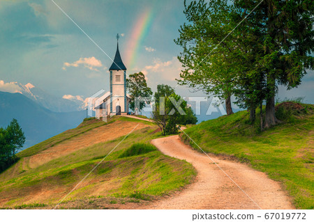 Idyllic rainbow landscape with Saint Primoz church, near Jamnik, Slovenia Idyllic rainbow landscape with Saint Primoz church, near Jamnik, Slovenia 67019772