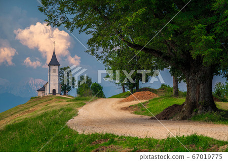 Idyllic alpine landscape with Saint Primoz church, near Jamnik, Slovenia Idyllic alpine landscape with Saint Primoz church, near Jamnik, Slovenia 67019775