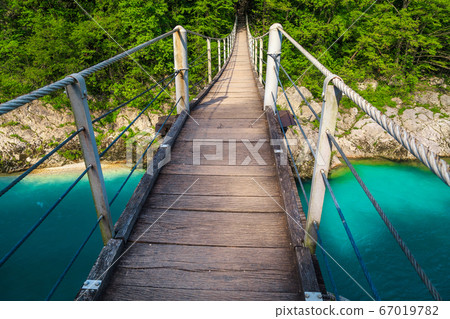 Suspended bridge above the emerald color Isonzo river, Kobarid Slovenia Suspended bridge above the emerald color Isonzo river, Kobarid Slovenia 67019782