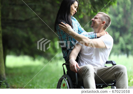 Smiling female and male outdoors Smiling female and male outdoors 67021038