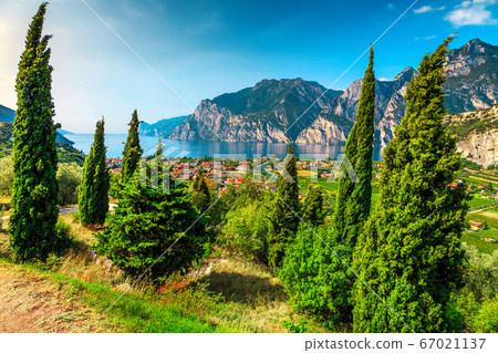 Lake Garda with high mountains on sunny summer day, Italy 67021137
