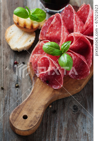 Delicious salami with basil and wine Delicious salami with basil and wine 67021623