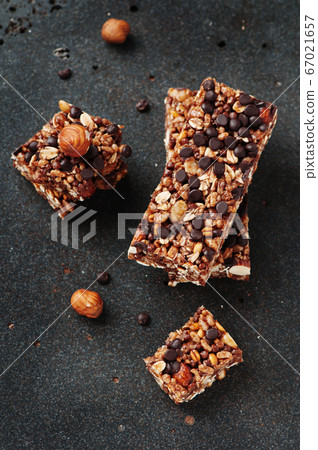 Cereal bar with nuts and chocolate Cereal bar with nuts and chocolate 67021657