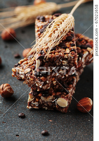 Cereal bar with nuts and chocolate Cereal bar with nuts and chocolate 67021658