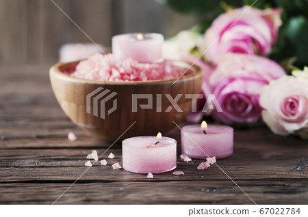 SPA treatment with pink salt and candles 67022784