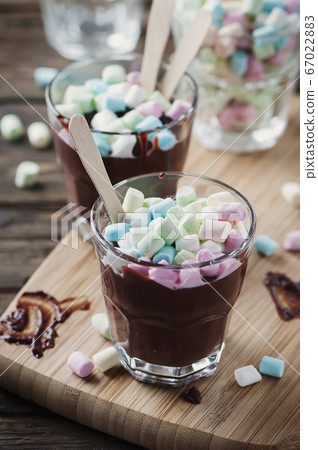 Hot chocolate with marshmallow on the wooden table Hot chocolate with marshmallow on the wooden table 67022883