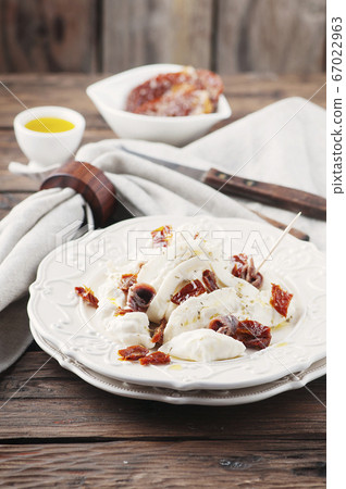 Traditional italian antipasto with burrata and dry 67022963
