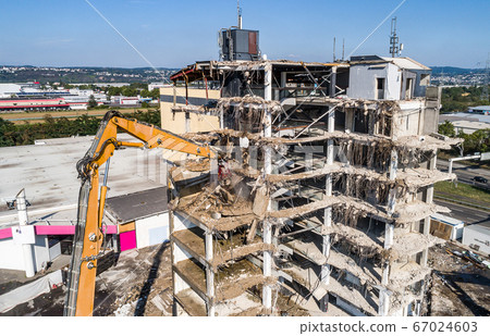 Aerial view of Building House Demolition and construction site Excavator with hydraulic crasher machine 67024603