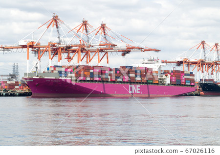 View of a colorful cargo ship on a container wharf 67026116