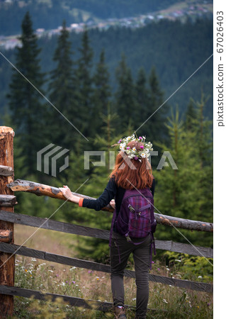 girl in a wreath of wildflowers girl in a wreath of wildflowers 67026403