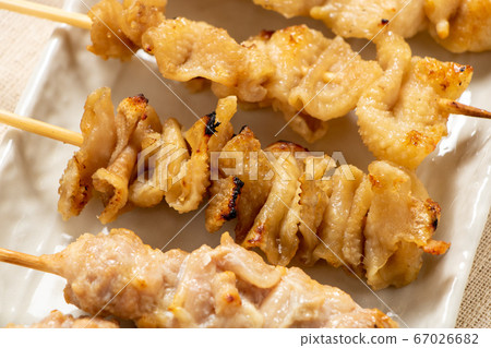 An assortment of chicken skewers with a yakitori (salted) platter. An assortment of chicken skewers with a yakitori (salted) platter. 67026682