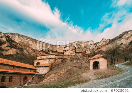 Mtskheta, Georgia. Shio-Mgvime Monastery. Upper Church Of Holy Virgin Or Theotokos, Central Part Of Medieval Monastic ShioMgvime Complex In Limestone Canyon Mtskheta, Georgia. Shio-Mgvime Monastery. Upper Church Of Holy Virgin Or Theotokos, Central Part Of Medieval Monastic ShioMgvime Complex In Limestone Canyon 67028091