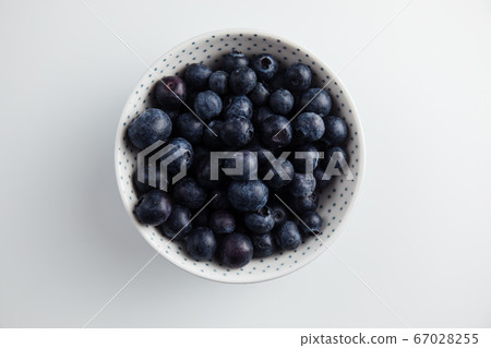 Close-up of blueberries on a wooden Board. Fresh berries Close-up of blueberries on a wooden Board. Fresh berries 67028255