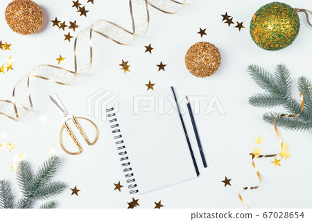 Empty notebook page among golden shiny Christmas 67028654