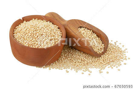 white quinoa seeds in wooden bowl isolated on white background with clipping path and full depth of field. white quinoa seeds in wooden bowl isolated on white background with clipping path and full depth of field. 67030593