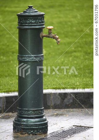 Close-up of old-style column with drinking water Close-up of old-style column with drinking water 67031706