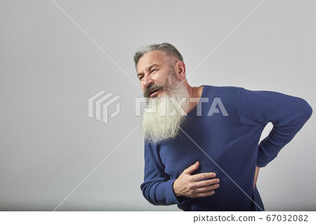 Portrait of mature gray-haired bearded man in blue Portrait of mature gray-haired bearded man in blue 67032082
