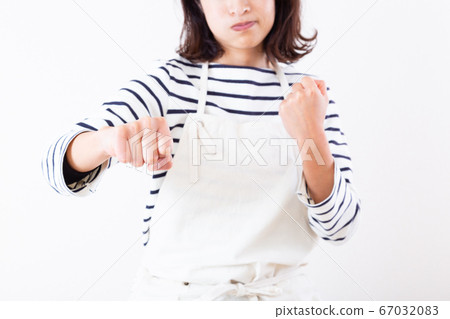 A woman punching A woman punching 67032083