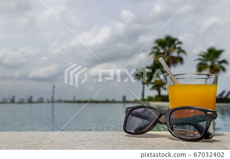 Relaxing moment by the pool. Relaxing moment by the pool. 67032402