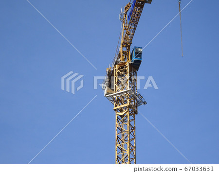Tower Crane used to lift the heavy load at the construction site. Manually operate by the operator. Normally used at huge scale or high rise building construction.    67033631