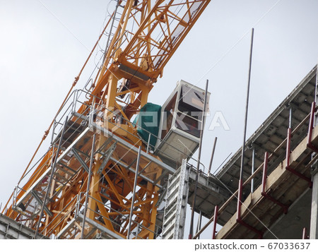 Tower Crane used to lift the heavy load at the construction site. Manually operate by the operator. Normally used at huge scale or high rise building construction.    67033637
