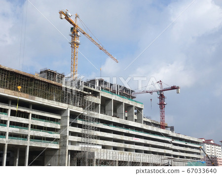 Tower Crane used to lift the heavy load at the construction site. Manually operate by the operator. Normally used at huge scale or high rise building construction.    67033640