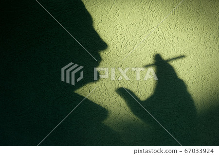 Smoking isues, silhouette of man smoking cigarette 67033924