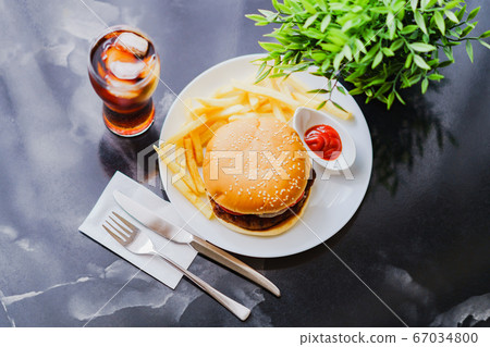 Diet enemies: hamburgers, potatoes and diet coke [image of fast food] 67034800