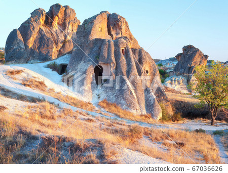 Cave Dwellings in an Arid Landscape in Cappadocia 67036626
